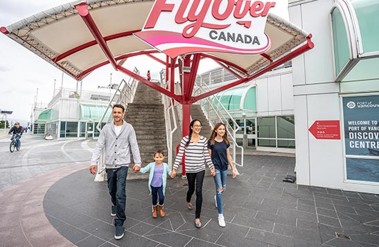 A family walks away from a set of stairs for FlyOver Canada.