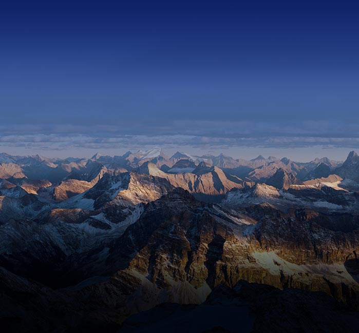 A mountain range in shadows