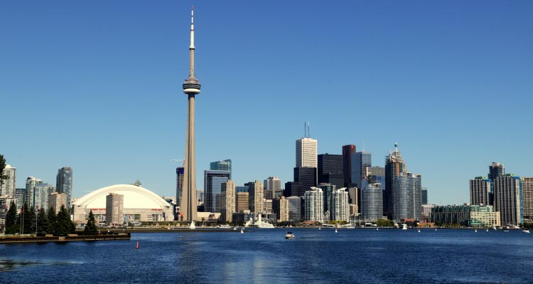 Toronto's skyline; featuring CN Tower towering above skyscrapers.