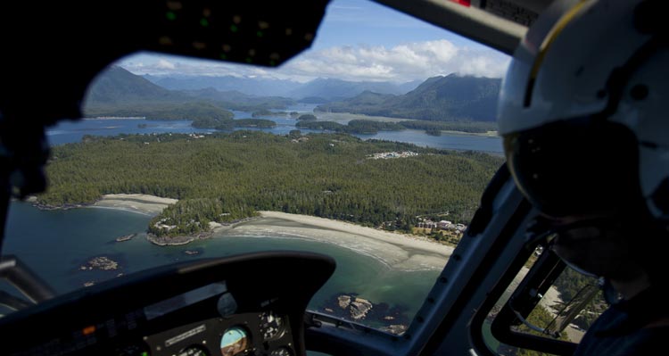 A view of beaches and forested islands from a helicopter