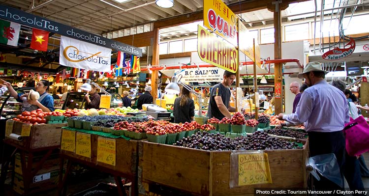 A fruit and vegetable stand in a covered market
