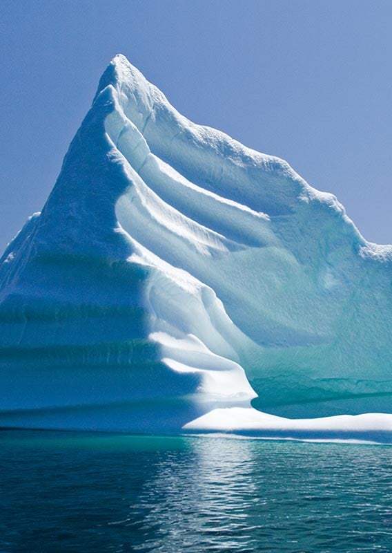 A large iceberg in blue ocean