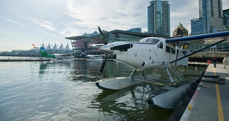 A float plane docked in a harbour.