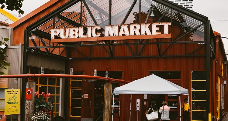 The entrance to a covered market with a big sign "Public Market"