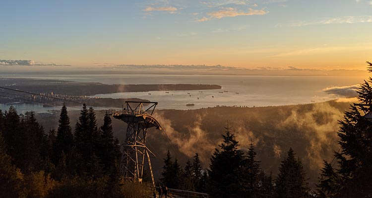 View overlooking Vancouver and the sea from atop a mountain.