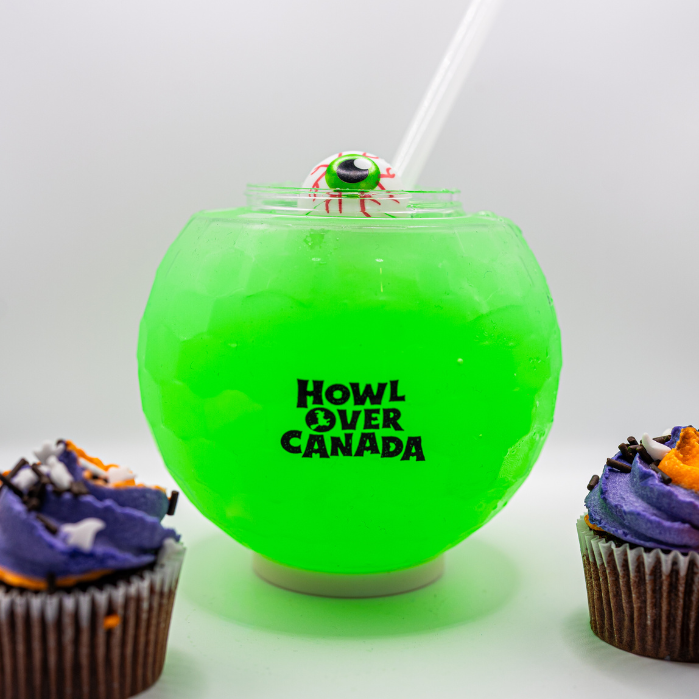 A green drink decorated with a fake eyeball for Hallowe'en.