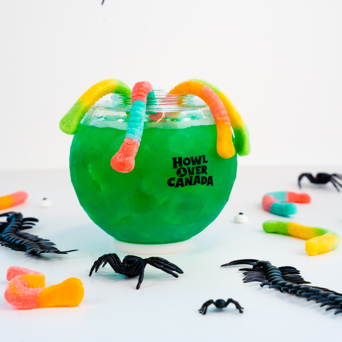 A green drink decorated with a fake eyeball for Hallowe'en.